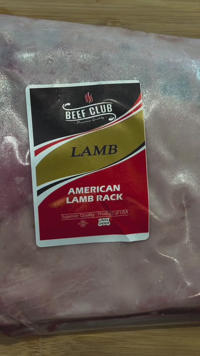 Beef Club™ USDA Choice American Lamb Rack displayed with its succulent, evenly spaced ribs and a well-trimmed fat cap, showcasing the tenderness and quality of the cut, ready for fine dining preparation